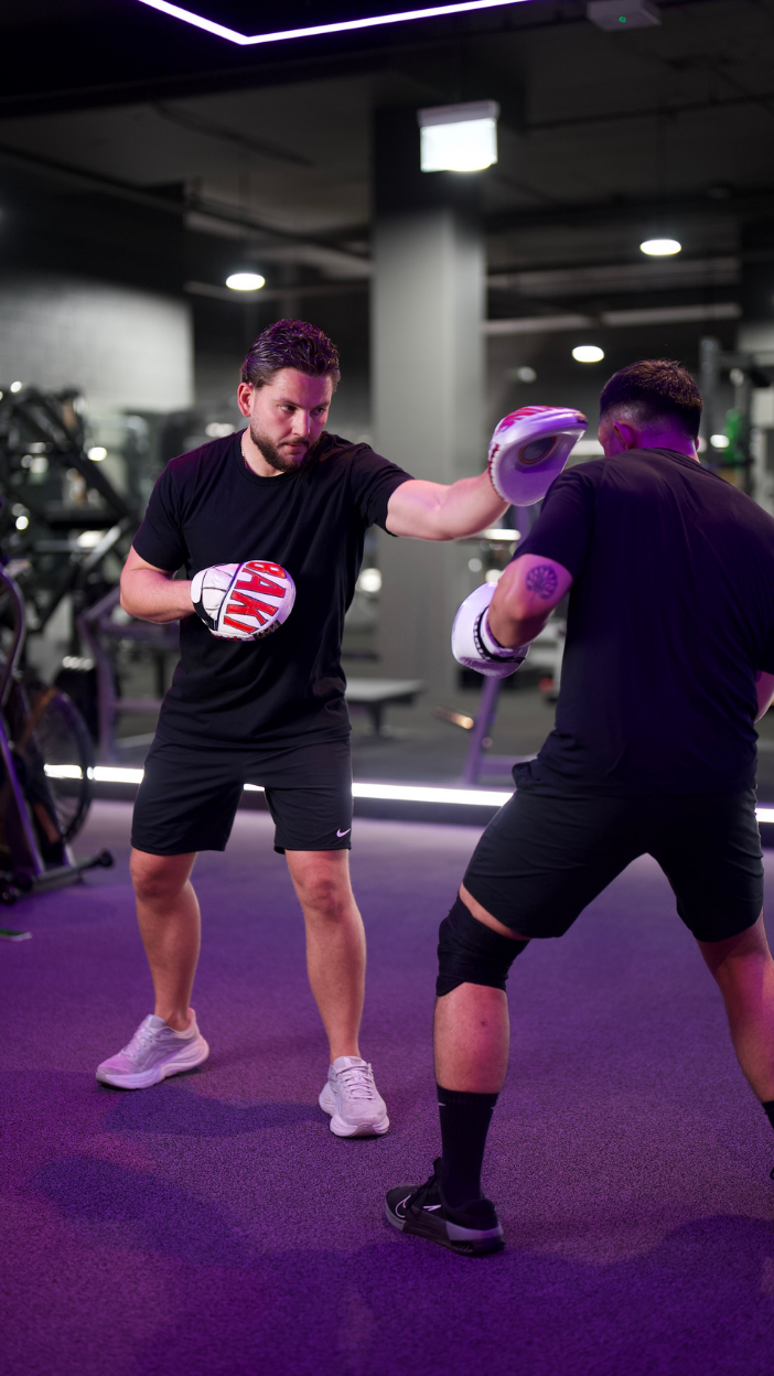 Coach Baki leading a private padwork lesson in Wentworth Point