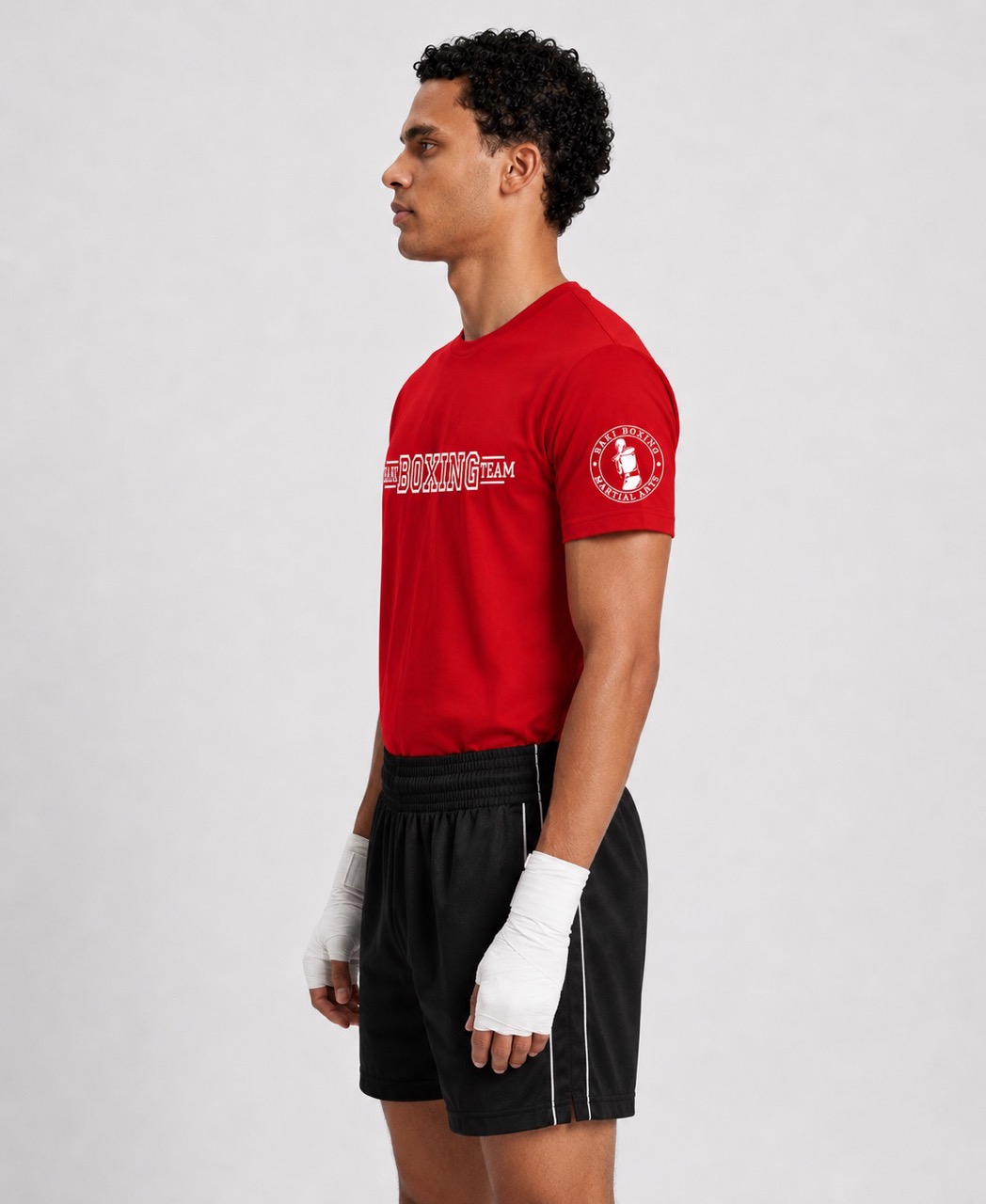 Model wearing the front of the red Baki Boxing Team T-shirt